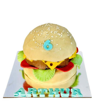 Dog Birthday Cake designed as a burger, perfect for a dog's special day, featuring a fun number six decoration.
