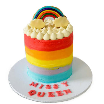 Dog Birthday Cake featuring vibrant rainbow layers and fluffy topping, perfect for a dog birthday rainbow cake.