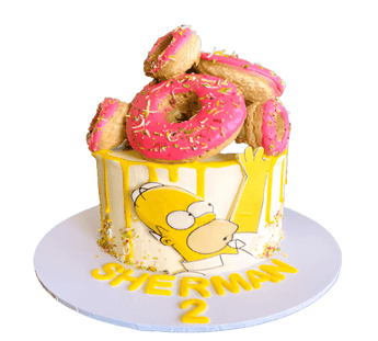 Colorful dog birthday cake topped with pink doughnuts, perfect for a festive celebration.