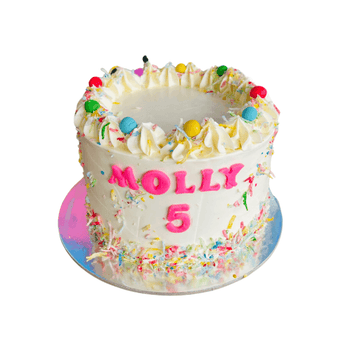 Dog birthday cake with sprinkles and personalized name for a furry friend's celebration.