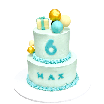Dog Birthday Cake with Balloons for Max's 6th birthday party, featuring two tiers and colorful decorations.
