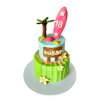 Whimsical 2-Tier Aloha Cake with surfboard and palm tree decorations for a dog party.