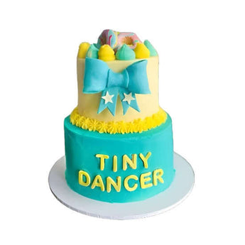 2-Tier Bow Tie Cake designed for a dog party, featuring colorful decorations and a bow tie centerpiece.