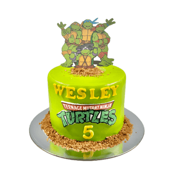 TMNT dog birthday cake featuring vibrant green design and Teenage Mutant Ninja Turtles for a fun dog party.