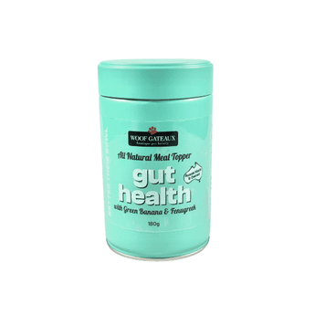 Natural dog meal topper for gut health with green banana and fenugreek in a mint-colored jar.