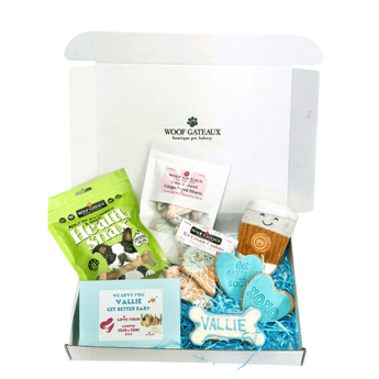 Dog recovery gift box with Healthy Dog Treats and personalized cookies for uplifting pups.