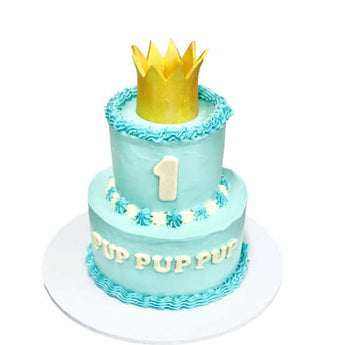 2-Tier dog birthday cake with crown in blue and gold, perfect for a pet's special celebration.