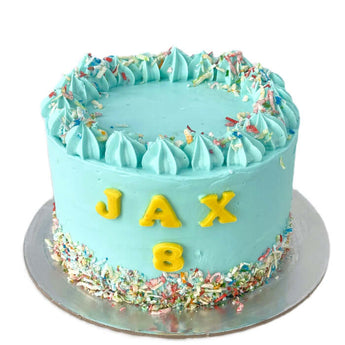 Dog Birthday Cake with Sprinkles for Jax's 8th Dog Party, featuring vibrant icing and colorful sprinkles.