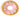 Squeaky plush dog toy shaped like a donut, perfect for entertaining and engaging your furry friend.