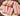 Iced Vovos -2pk handcrafted dog treats on a plate, featuring pink icing and coconut toppings.